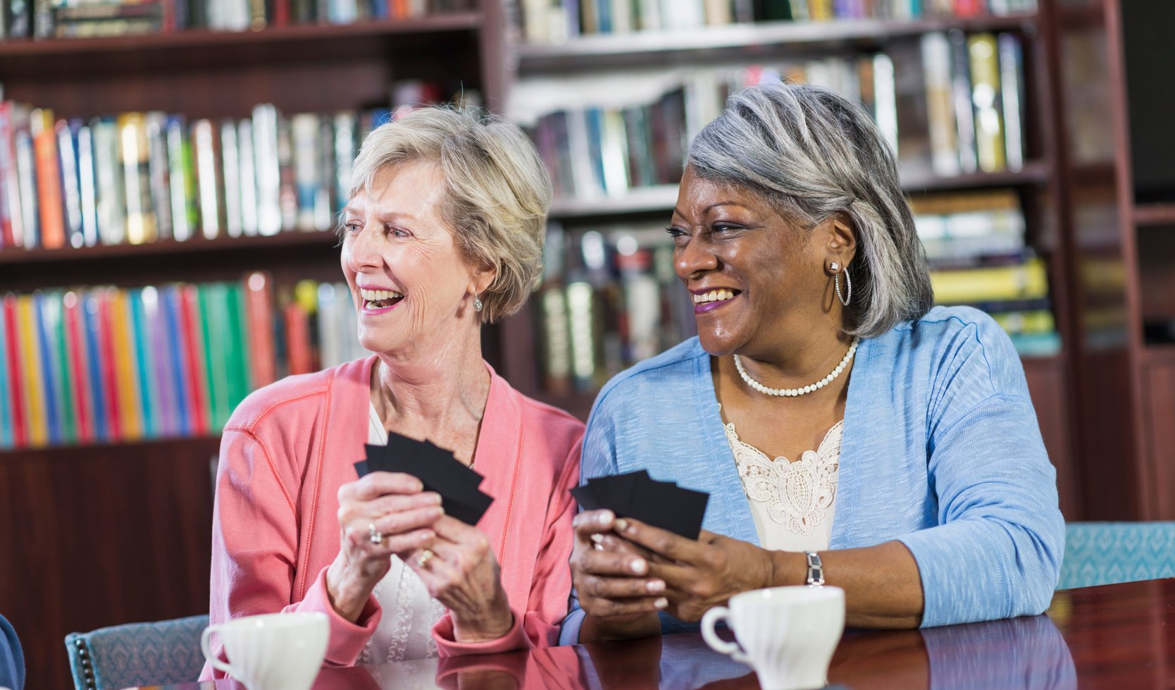 Senior women playing card game