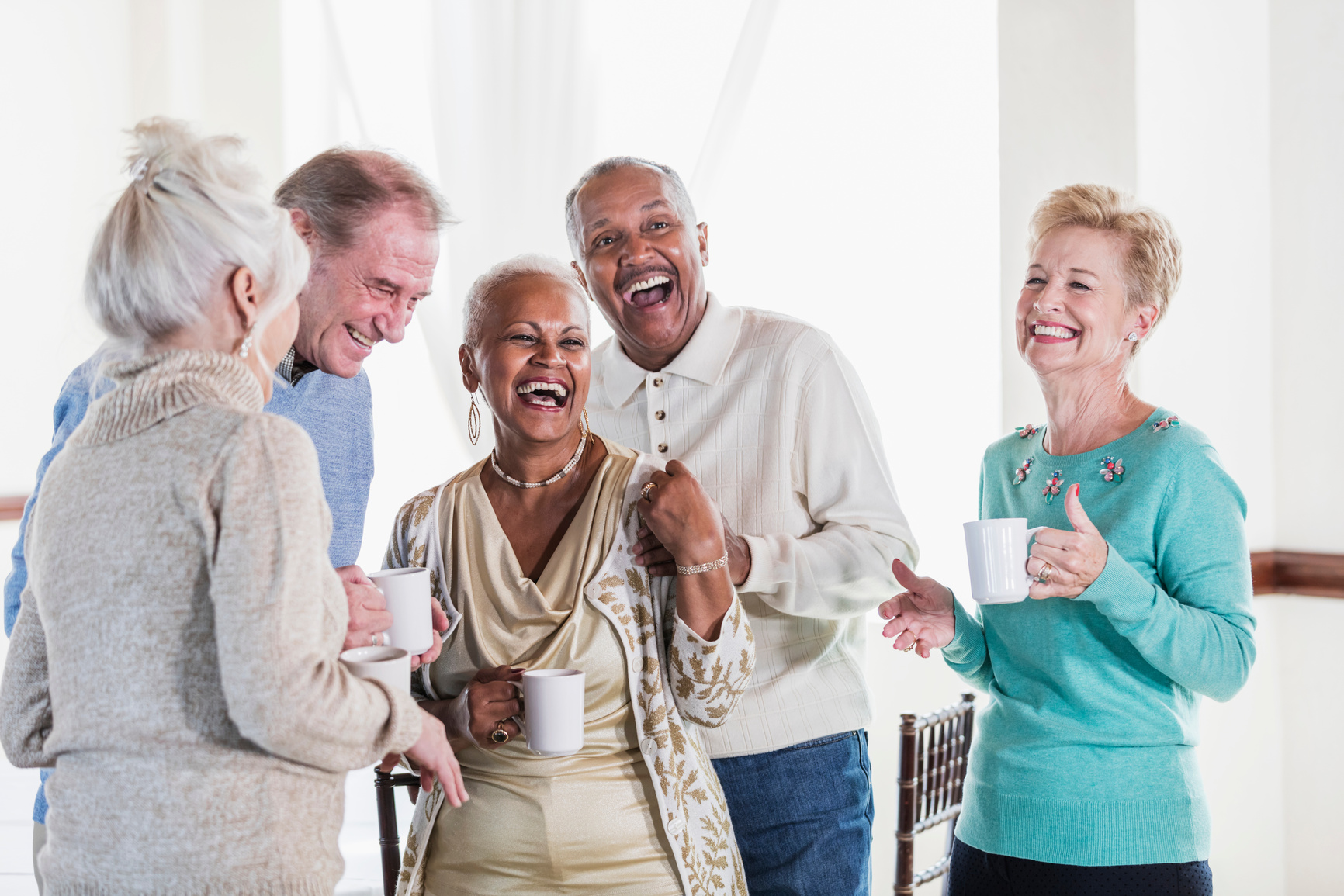 Group of seniors socializing over coffee